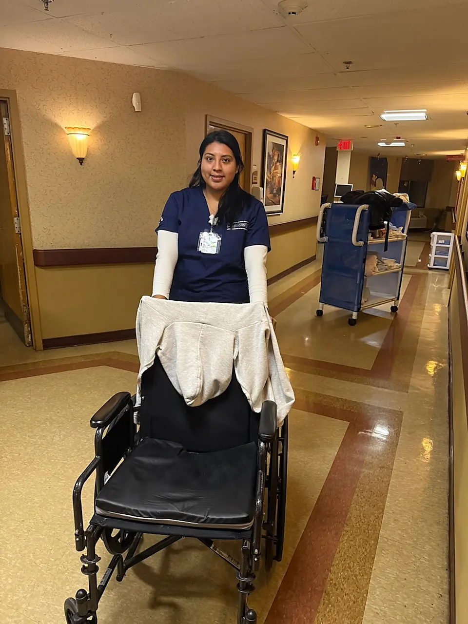 Berenise Rodriguez in nursing scrubs at Hudson View Nursing and Rehab Center